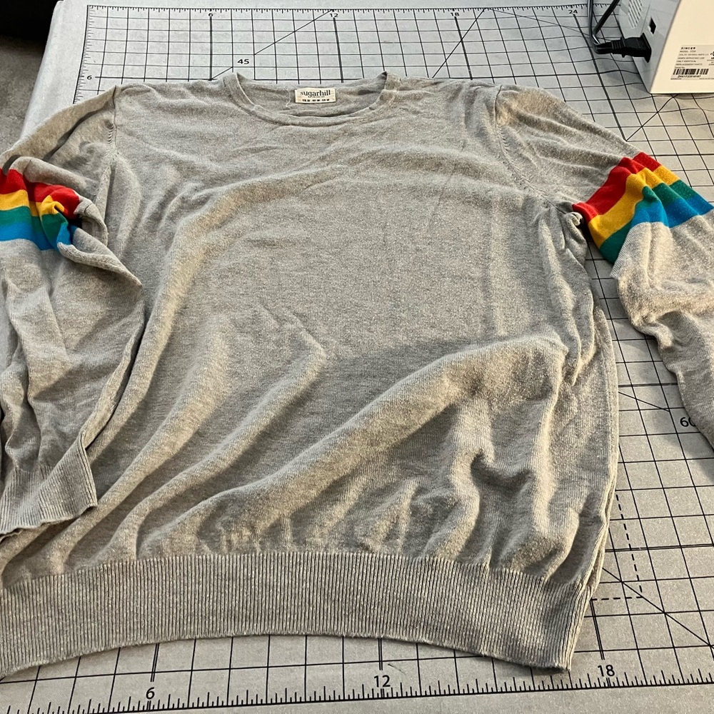 Size XL Sugarhill grey with rainbow bands (quirky pride ?) sweater.